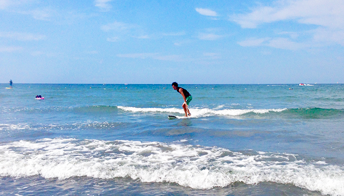 Surfing with family in early morning.